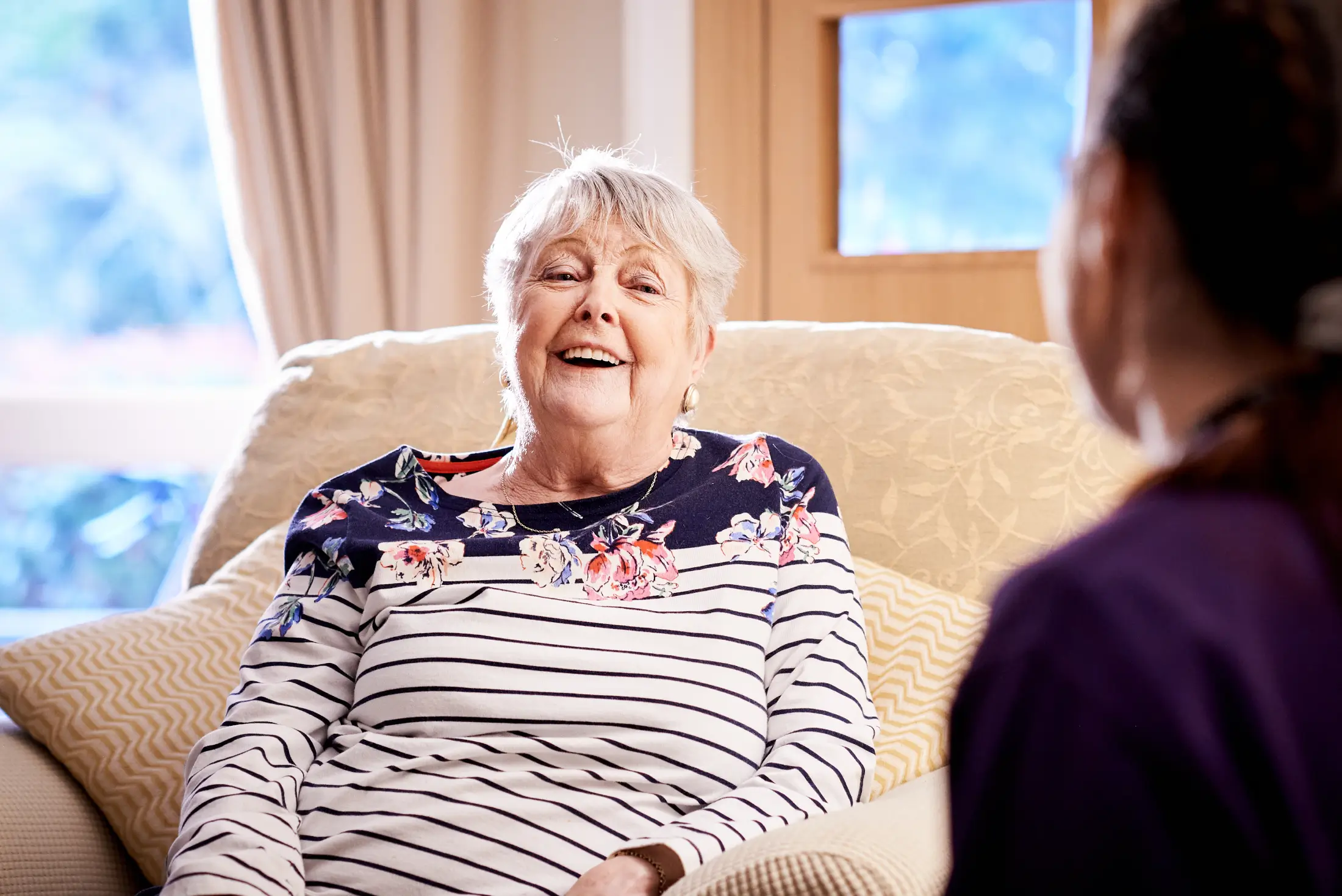 Older person on sofa
